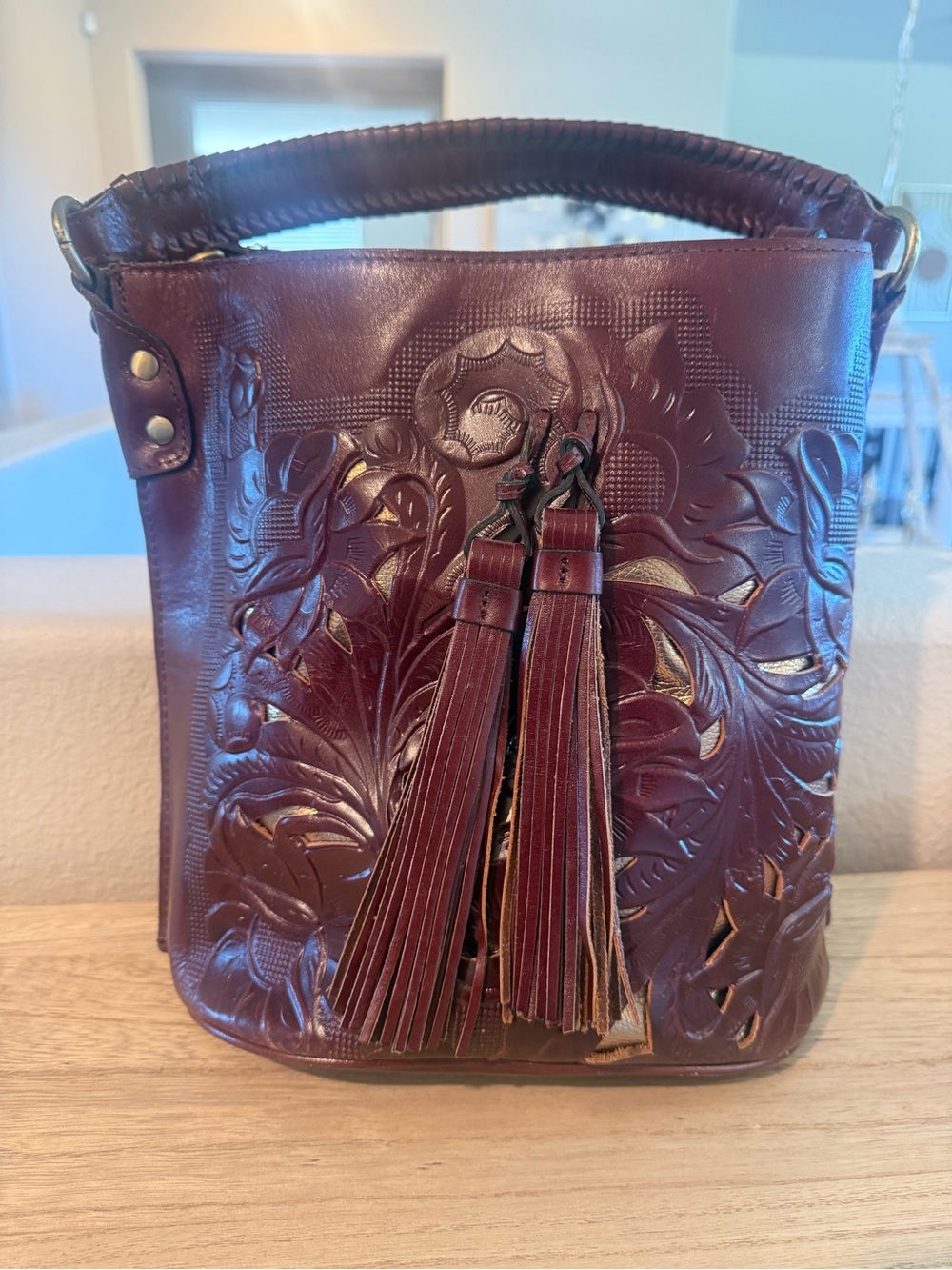 Patricia Nash Embossed Leather Bucket Bag in Burgundy with Tassels